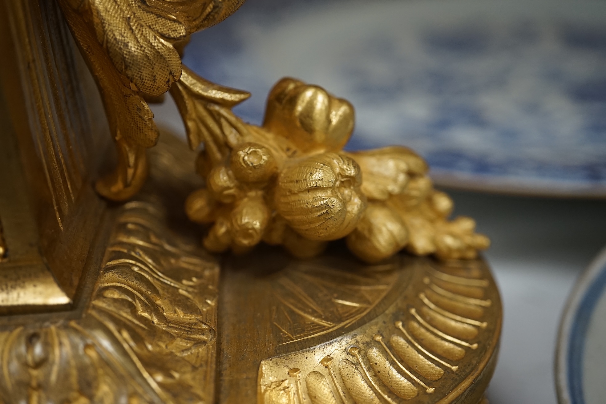 A French ormolu, black figural porcelain mounted mantel clock, 28cm wide x 36cm high. Condition - face and ormolu worn, unknown if clock working.